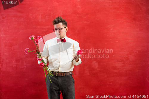 Image of Young funny man with broken bouquet