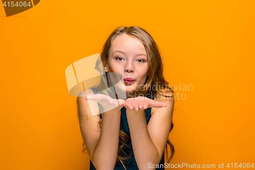 Image of The face of playful happy teen girl