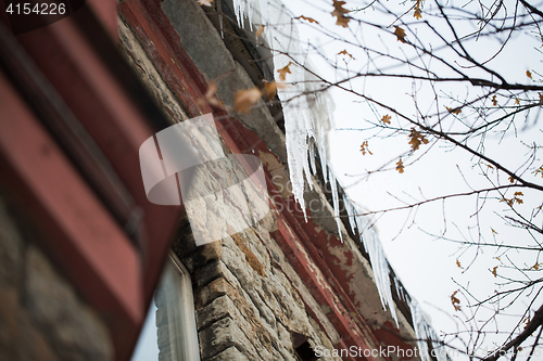 Image of icicles hanging from building roof