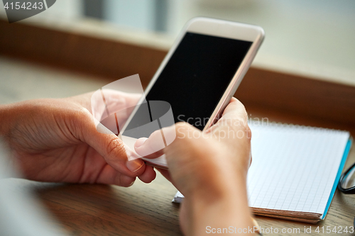 Image of close up of woman texting on smartphone