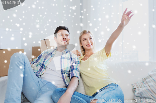 Image of couple with boxes moving to new home and dreaming