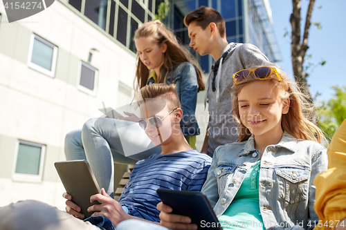 Image of group of students with tablet pc at school yard