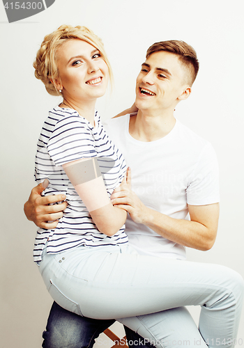 Image of young pretty teenage couple, hipster guy with his girlfriend happy smiling and hugging isolated on white background, lifestyle people concept