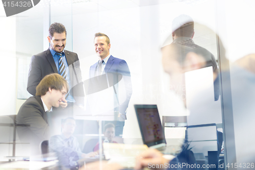 Image of Business people in modern office.