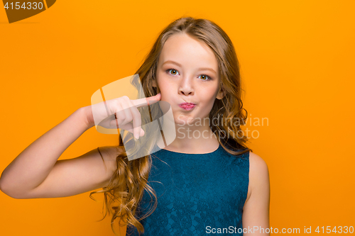 Image of The face of playful happy teen girl