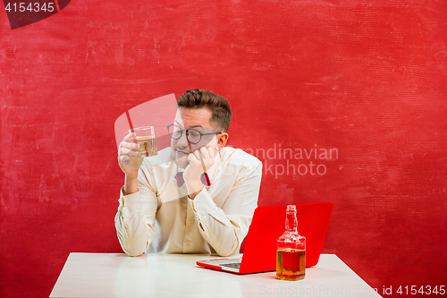 Image of Young funny man with laptop at St. Valentine\'s Day