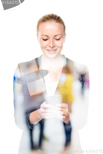 Image of Portrait of beautiful young caucasian woman using mobile phone.