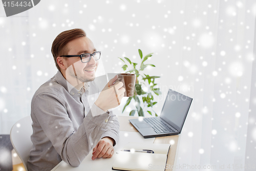 Image of creative man or businessman drinking coffee