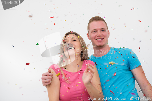 Image of romantic young  couple celebrating  party with confetti