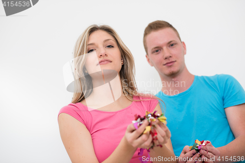 Image of romantic young  couple celebrating  party with confetti