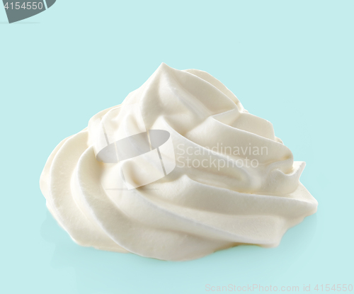 Image of whipped cream on blue background