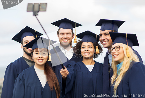 Image of students or bachelors taking selfie by smartphone