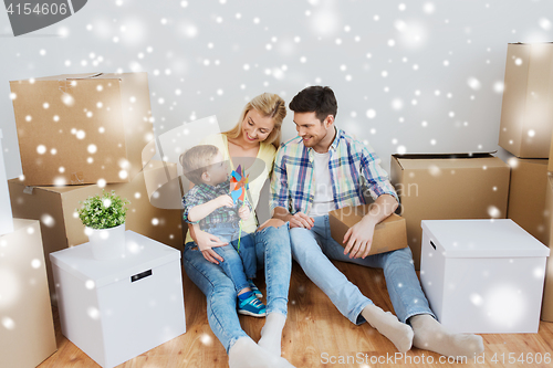 Image of happy family with boxes moving to new home