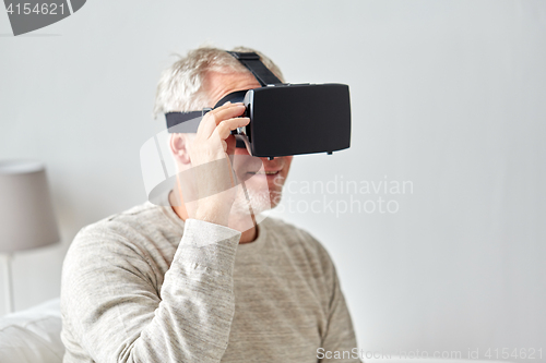 Image of old man in virtual reality headset or 3d glasses