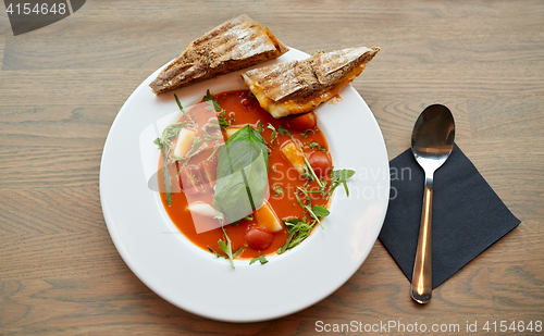 Image of plate of delicious gazpacho soup at restaurant