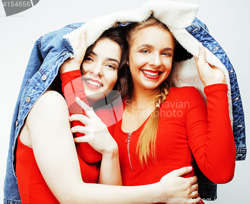 Image of lifestyle and people concept: Fashion portrait of two stylish sexy girls best friends, over white background. Happy time for fun.