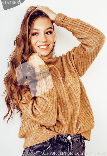 Image of young pretty stylish hipster girl posing emotional isolated on white background happy smiling cool smile, lifestyle people concept, winter sweater