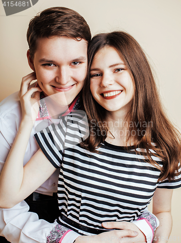 Image of couple of happy smiling teenagers students, warm colors having a