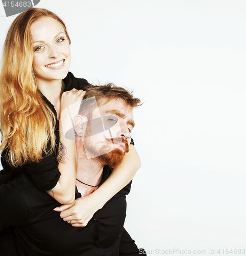 Image of young hipster couple fooling around on white background close up