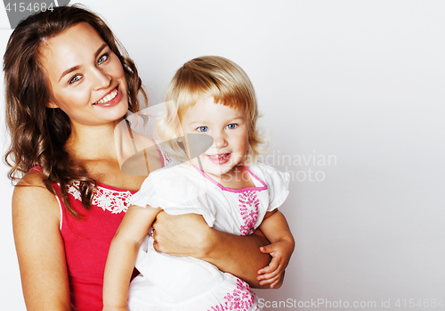 Image of young pretty stylish mother with little cute daughter hugging, h