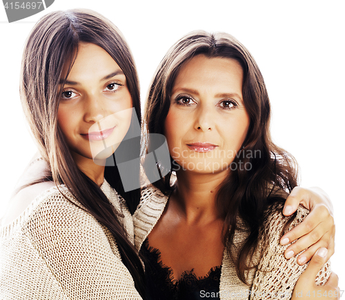 Image of cute pretty teen daughter with mature mother hugging, fashion st