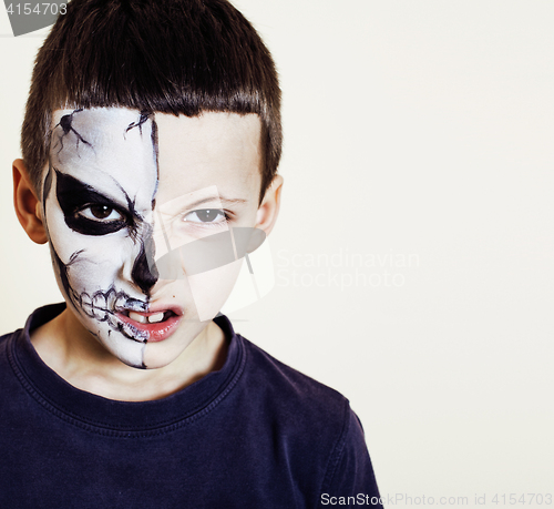 Image of little cute boy with facepaint like skeleton to celebrate hallow