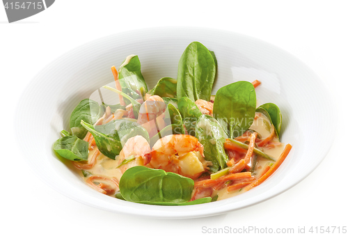 Image of fried prawns and vegetables with coconut sauce