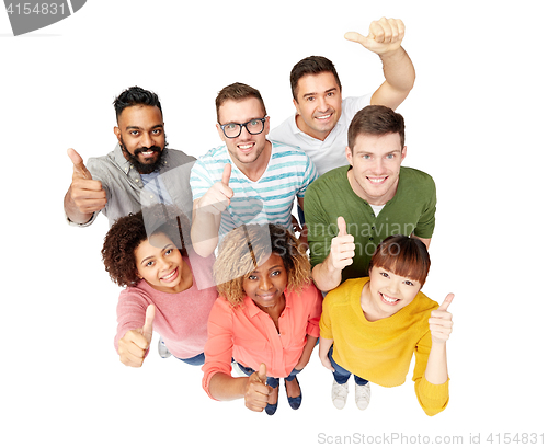 Image of international group of people showing thumbs up