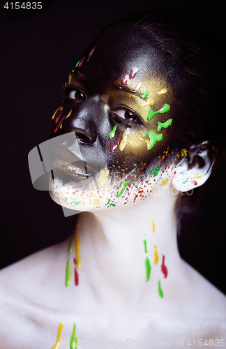 Image of woman with creative makeup closeup like drops of colors, facepai