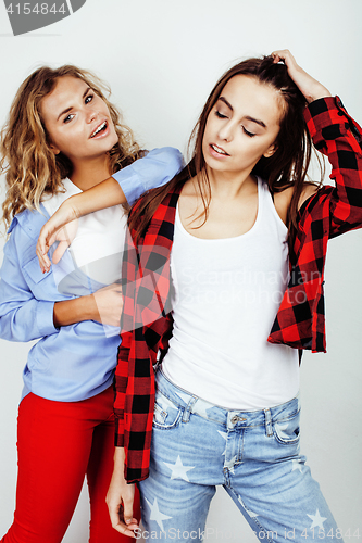 Image of two best friends teenage girls together having fun, posing emotional on white background, besties happy smiling, making selfie, lifestyle people concept