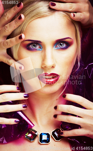 Image of beauty woman with creative make up, many fingers on face close u