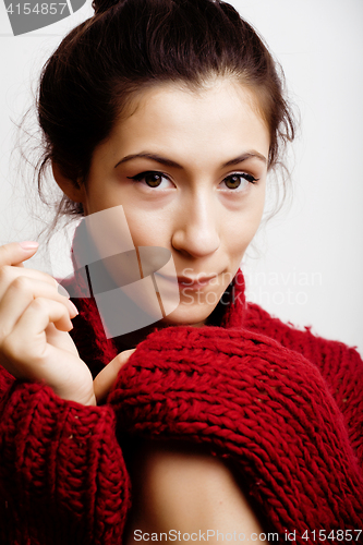 Image of young pretty woman in sweater and scarf all over her face, lifes