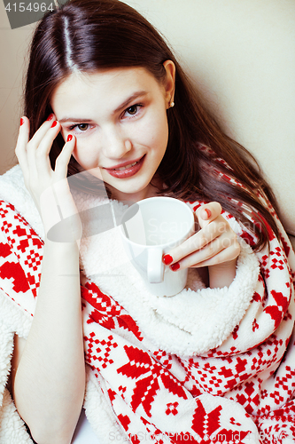 Image of young pretty brunette girl in Christmas ornament blanket getting warm on cold winter, freshness beauty concept, lifestyle people