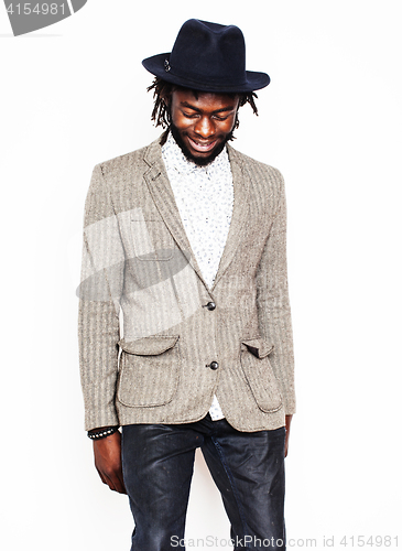 Image of young handsome afro american boy in stylish hipster hat gesturin