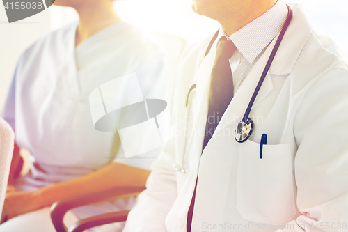 Image of close up of happy doctors at seminar or hospital