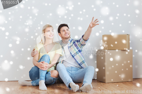 Image of couple with boxes moving to new home and dreaming