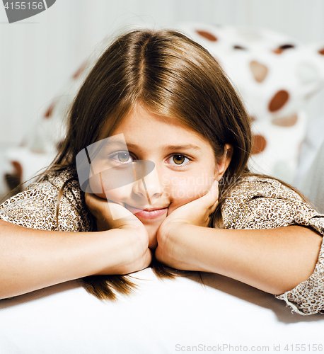 Image of little cute brunette girl at home smiling close up