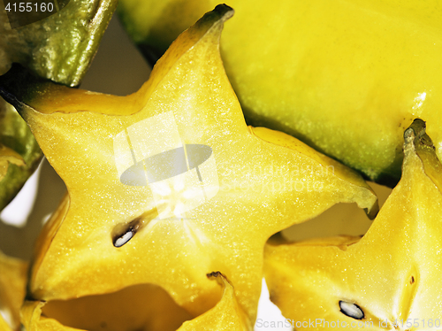 Image of delicious carambola asian exotic fruit on white background isola