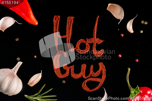 Image of Herbs and spices, chili pepper powder over black