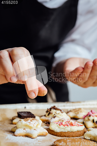 Image of Person finishing homemade cookies