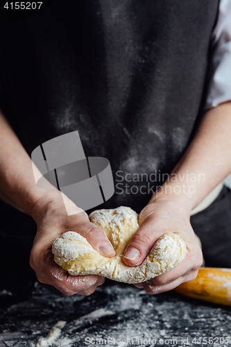 Image of Cook beating up cookie dough