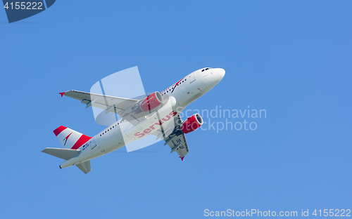 Image of Turbojet airplane Airbus A319 of Austrian Airlines gaining altit