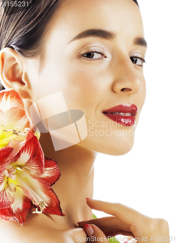 Image of young pretty brunette woman with red flower amaryllis close up i