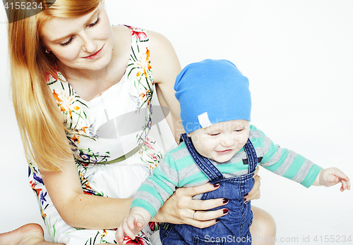 Image of young beauty mother with cute baby, red head happy modern family