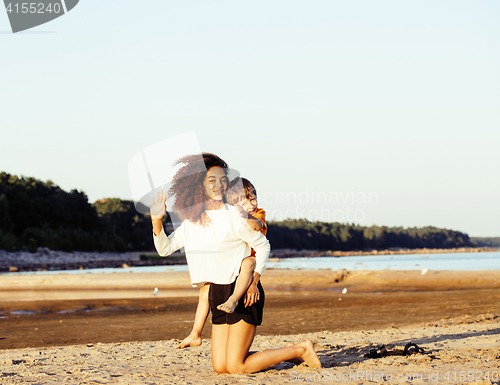 Image of pretty diverse nation and age friends on sea coast having fun, lifestyle people concept on beach vacations