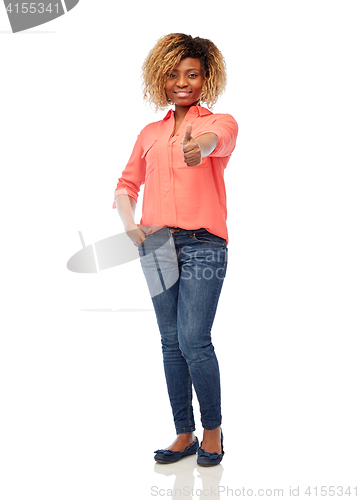 Image of happy african american woman showing thumbs up