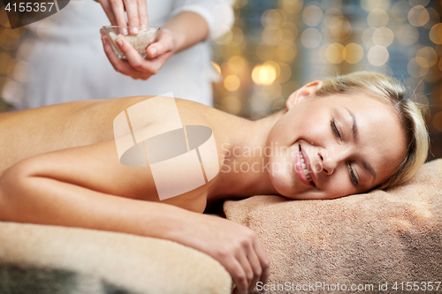 Image of close up of woman lying and having massage in spa