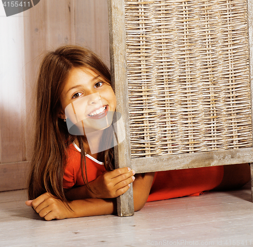 Image of real little cute brunette girl at home smiling close up