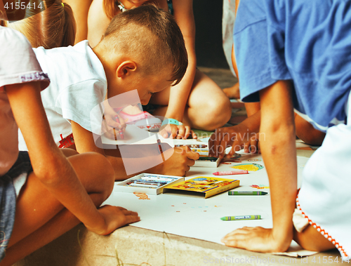 Image of little cute boy with company painting on birthday party