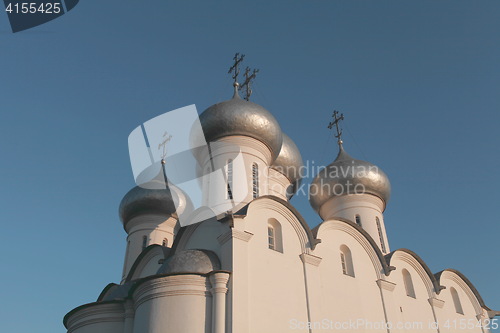 Image of white church with silver domes